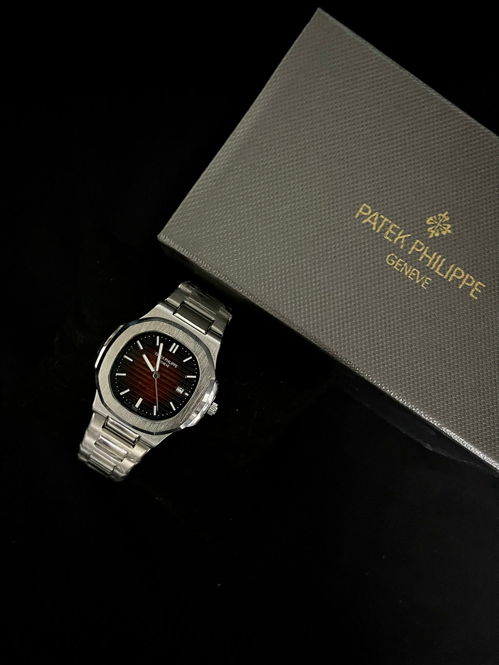 Patek Philippe Nautilus Orange Dial Stainless Steel Watch