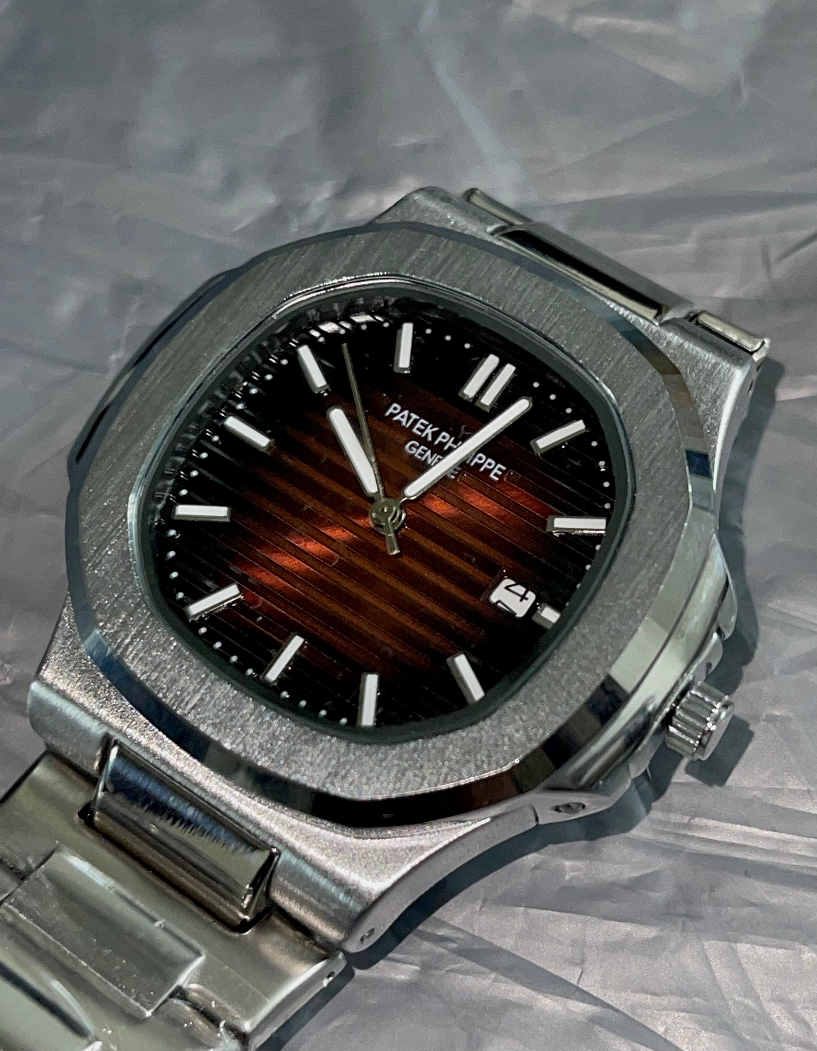 Patek Philippe Nautilus Orange Dial Stainless Steel Watch
